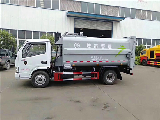 新款东风多利卡侧装压缩挂桶垃圾车